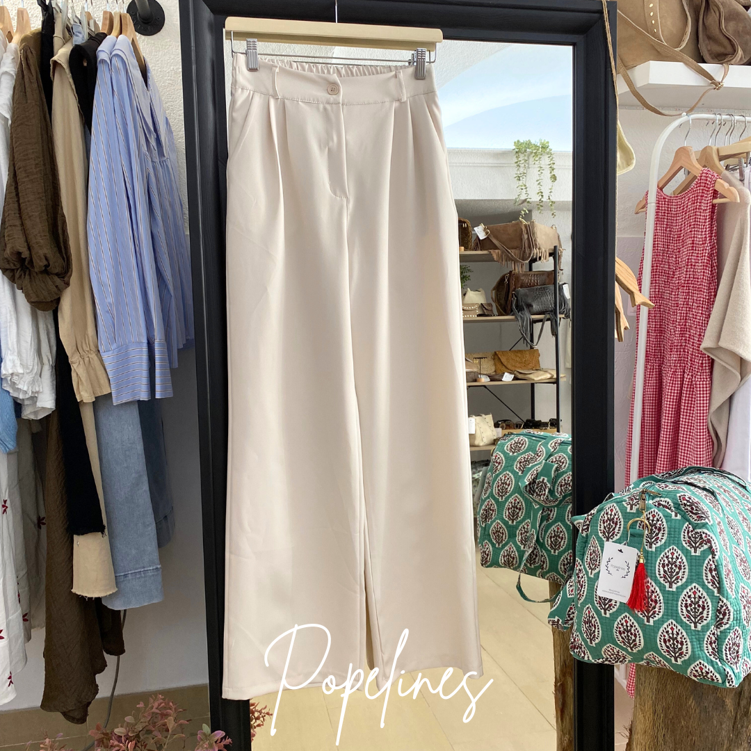 Pantalón pinzas beige.