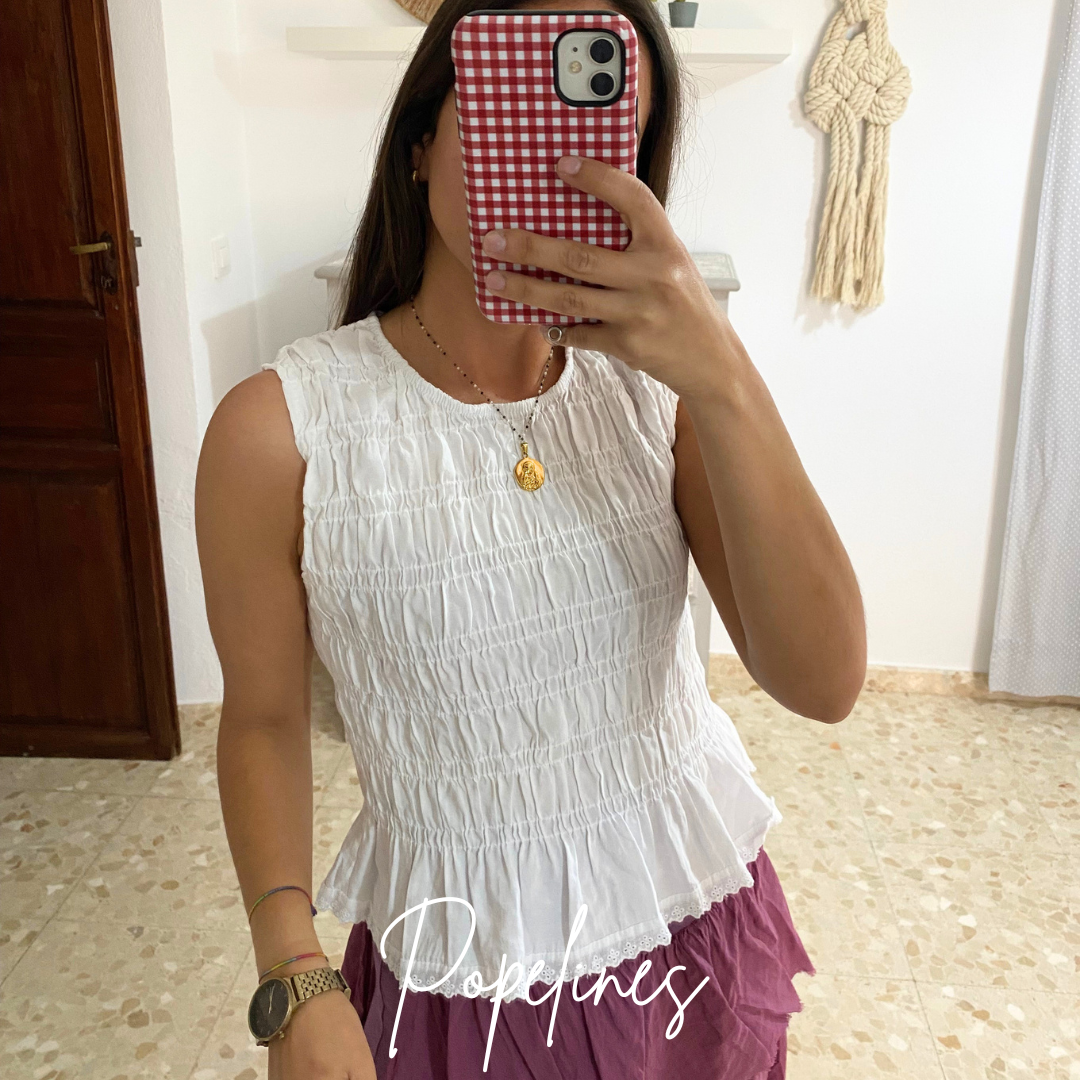 Top Andrea blanco