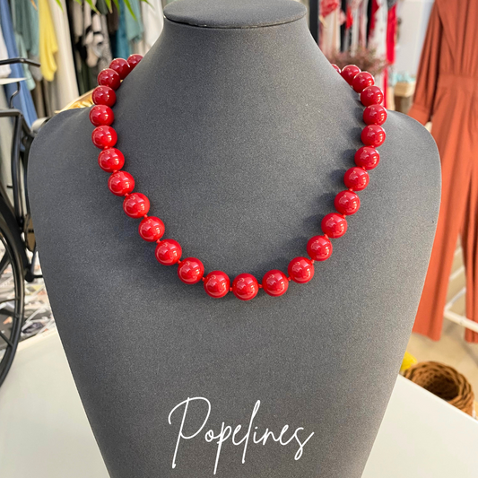 Cadena bolitas rojas.